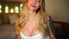 A super sexy blonde with big boobs and masturbating with a v