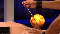 Bound stud endures melted candle wax and rough anal sex in an all-male gangbang