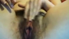 Two fingers is what her hairy juicy pussy wants
