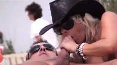 Hot mature wife in cowboy hat sucking dick on the beach