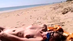 Girl masturbating by the sea